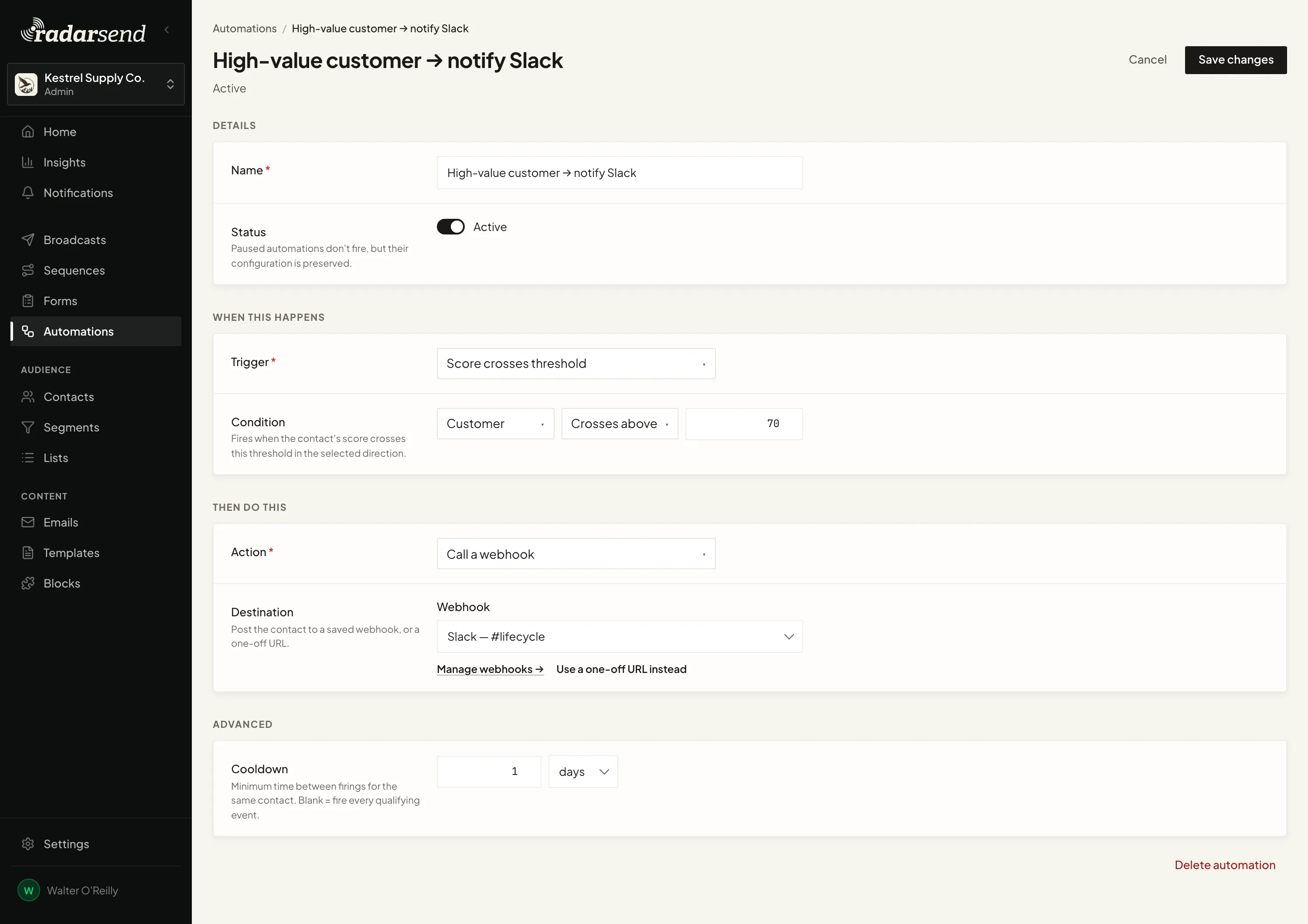 The Automation editor for a rule that posts to a Slack webhook when a customer score crosses 70, with Details, When this happens, Then do this, and a one-day cooldown under Advanced.